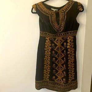Size 0 dress from nanette lepore has gold accents with black as the main color.